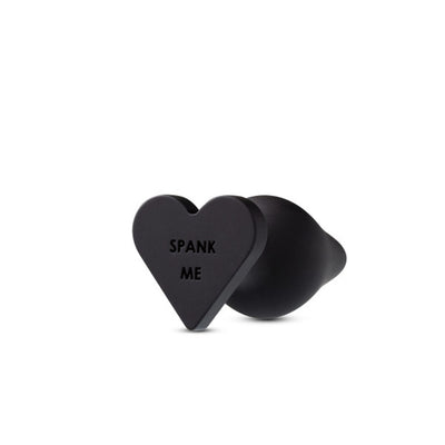 Luxurious Silicone Heart-Shaped Butt Plug with "Spank Me" or "Fuck Me" Message on Base for Naughty Fun. Easy to Insert, Safe, and Easy to Clean.